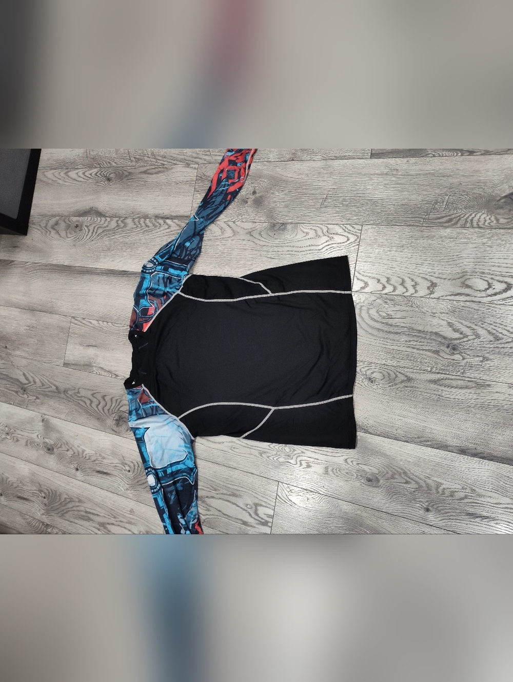 Set Of Two .Black Rash Guard with Blue & Red Graphic Sleeves